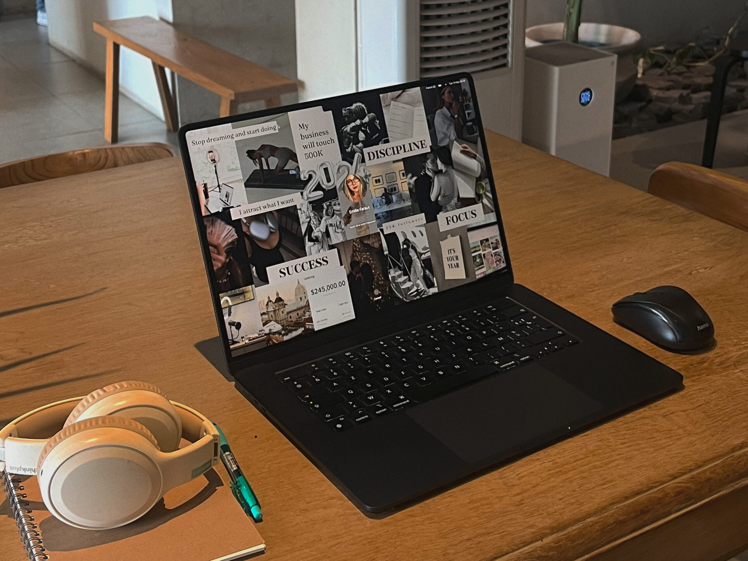 computer on a table open to a mood board.